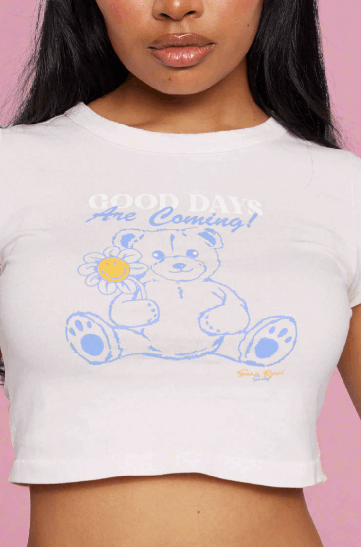 Samii Ryan x Smileyworld® Good Days Baby Tee T-Shirt by Samii Ryan as seen on celebrities