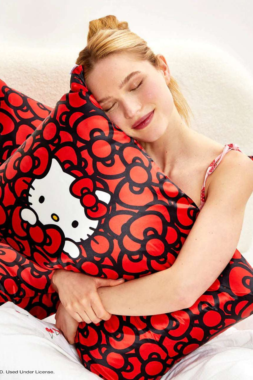 Hello Kitty x Kitsch Satin Pillowcase - Hello Kitty Bathes in a Sea of Bows Pillow by Kitsch as seen on celebrities