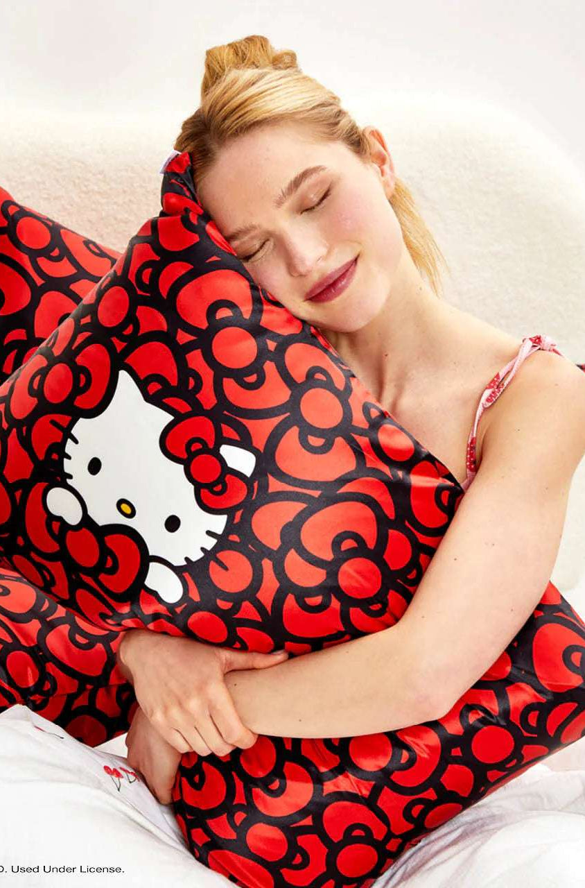 Hello Kitty x Kitsch Satin Pillowcase - Hello Kitty Bathes in a Sea of Bows Pillow by Kitsch as seen on celebrities