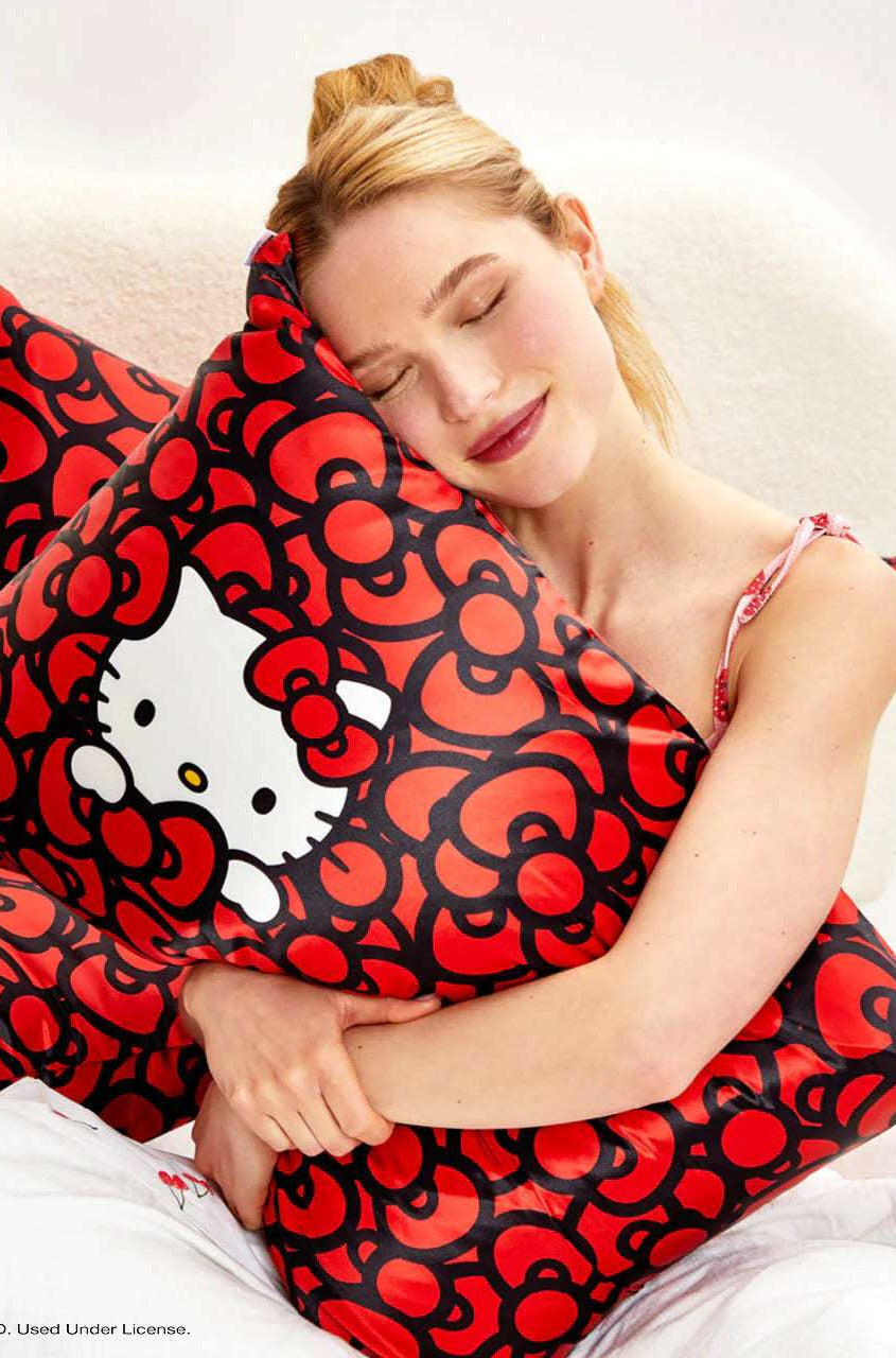 Hello Kitty x Kitsch Satin Pillowcase - Hello Kitty Bathes in a Sea of Bows Pillow by Kitsch as seen on celebrities