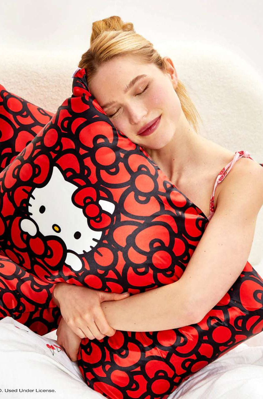 Hello Kitty x Kitsch Satin Pillowcase - Hello Kitty Bathes in a Sea of Bows Pillow by Kitsch as seen on celebrities