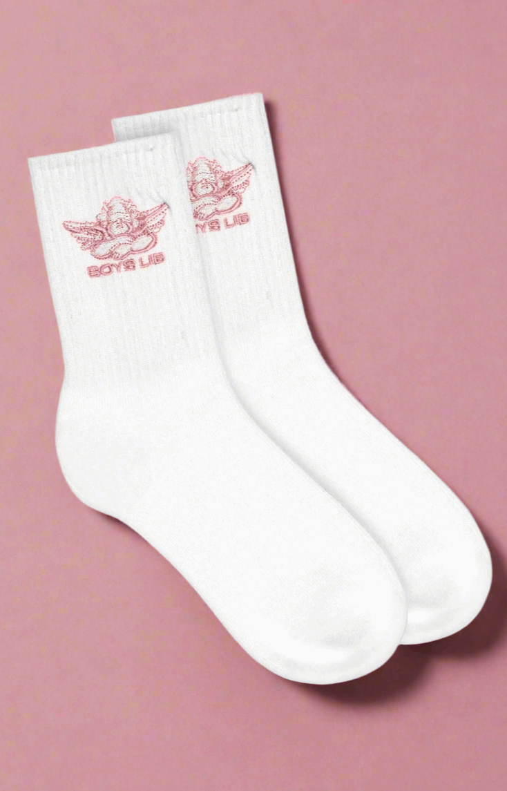 White socks with red logo on a pink background