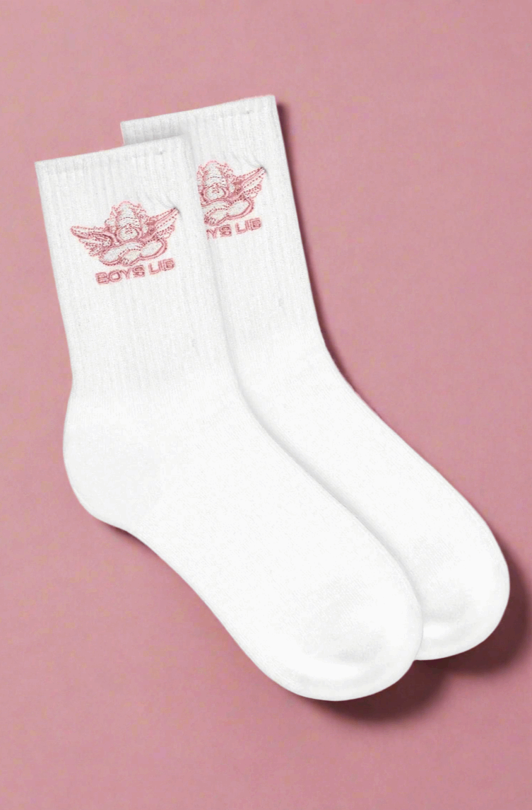 White socks with red logo on a pink background