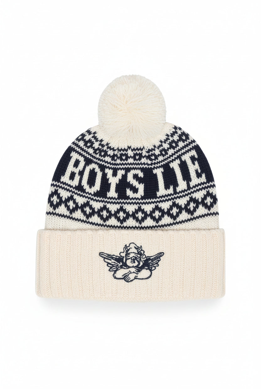 A cream and navy blue knit pom-pom beanie with 'BOYS LITE' written across the upper section and a small cherub graphic on the folded cuff.