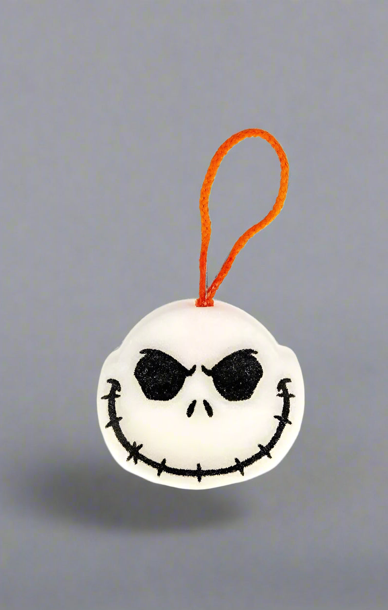 Plush keychain with a skull design on a white background