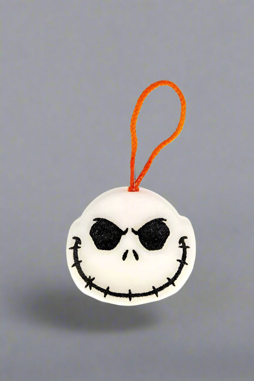 Plush keychain with a skull design on a white background