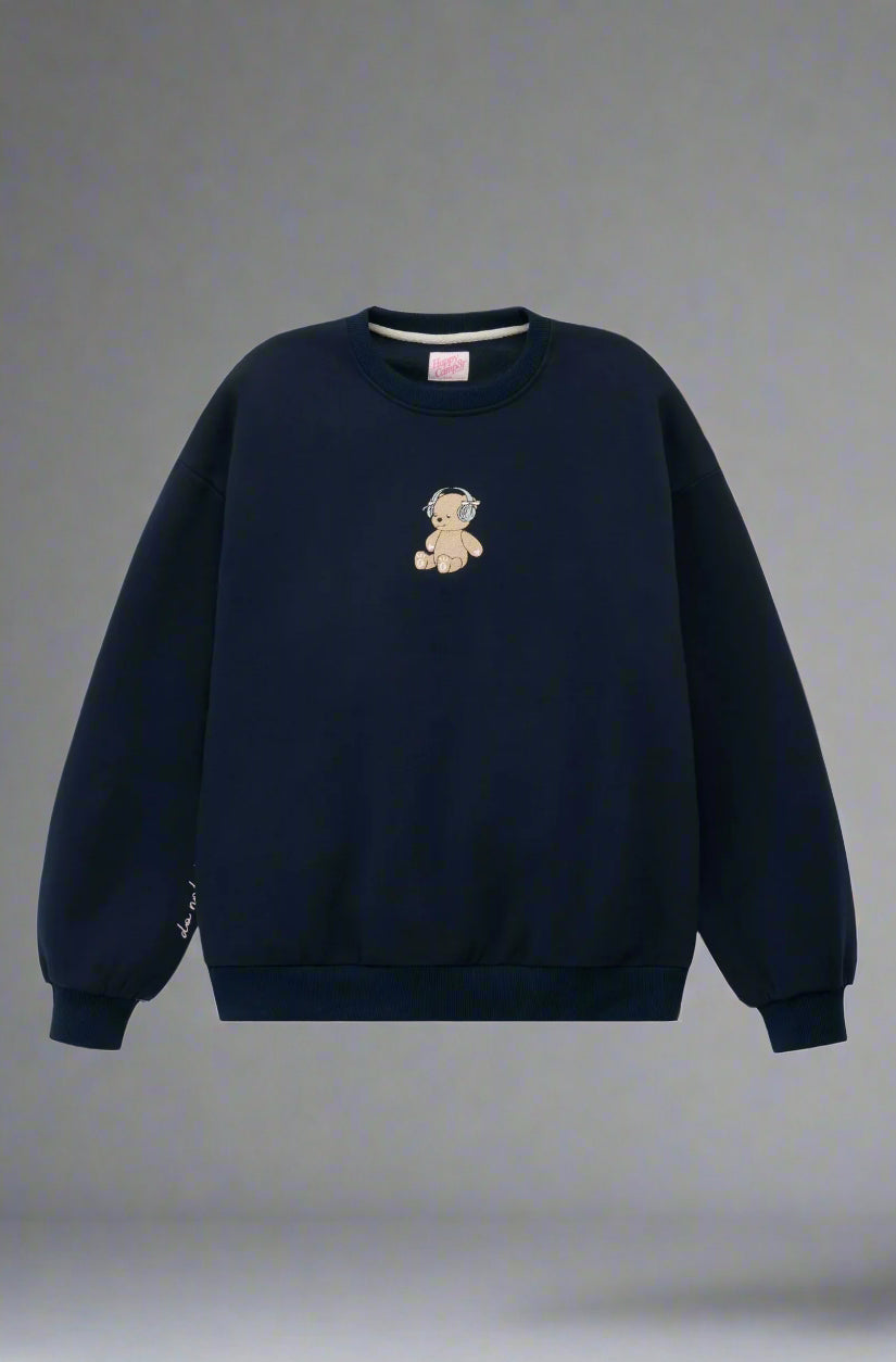 Navy blue sweatshirt with a teddy bear emblem on a light gray background
