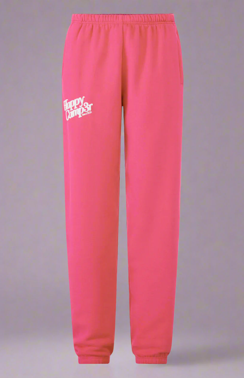 Pink sweatpants with a logo on a white background