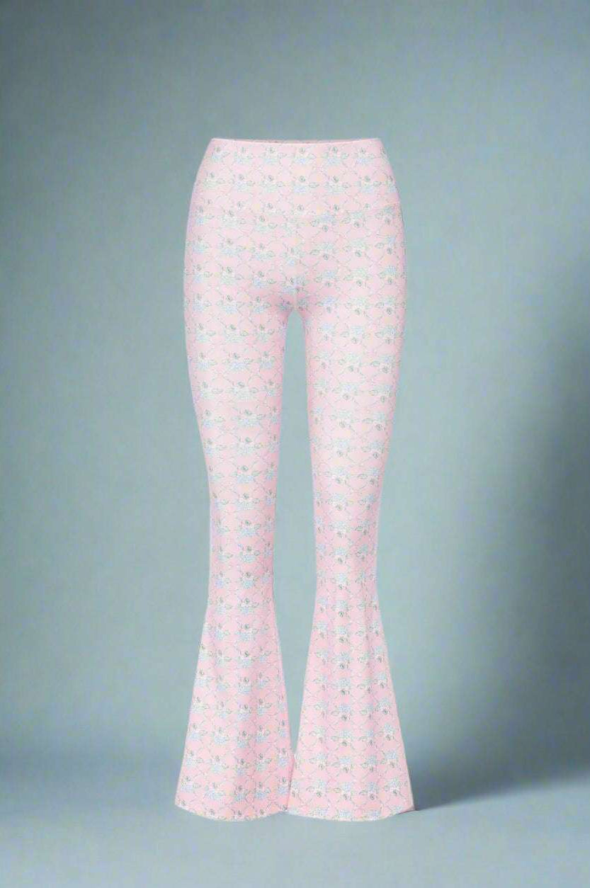 Flared pants with a subtle pattern on a white background