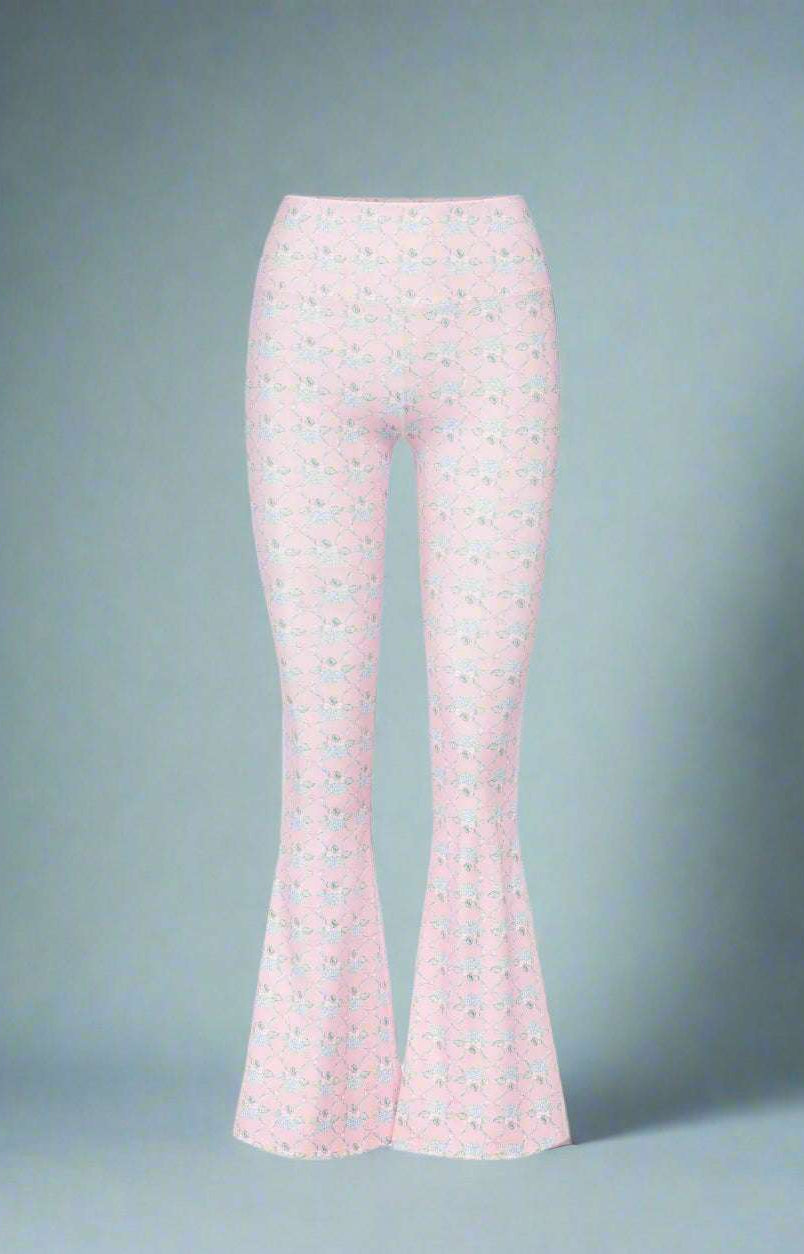 Flared pants with a subtle pattern on a white background