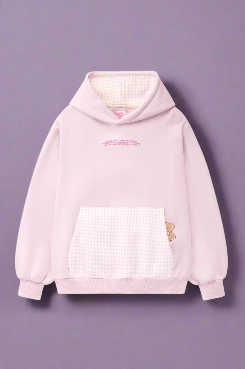 Pink hoodie with a checkered front panel and butterfly design on a white background