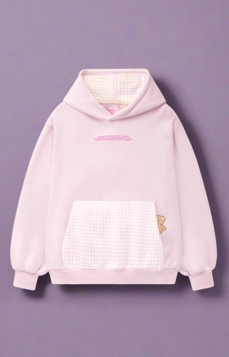 Pink hoodie with a checkered front panel and butterfly design on a white background