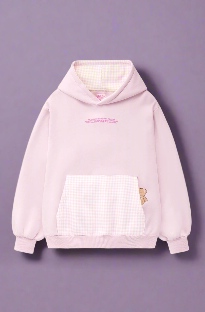 Pink hoodie with a checkered front panel and butterfly design on a white background