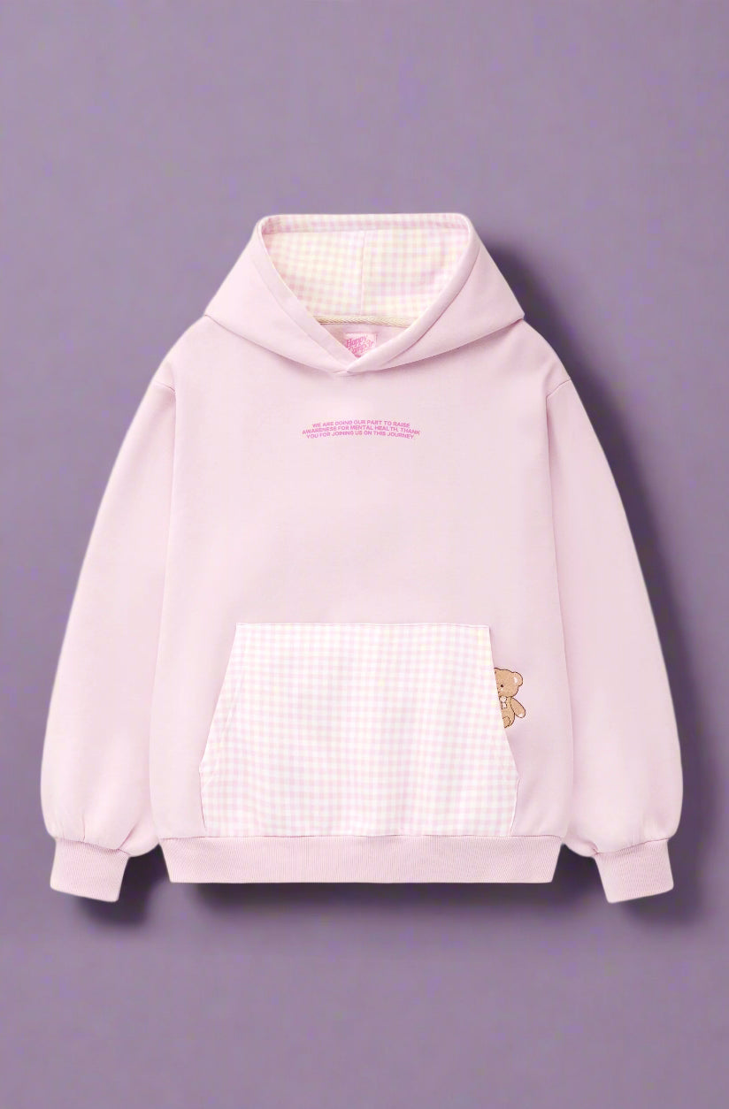 Pink hoodie with a checkered front panel and butterfly design on a white background