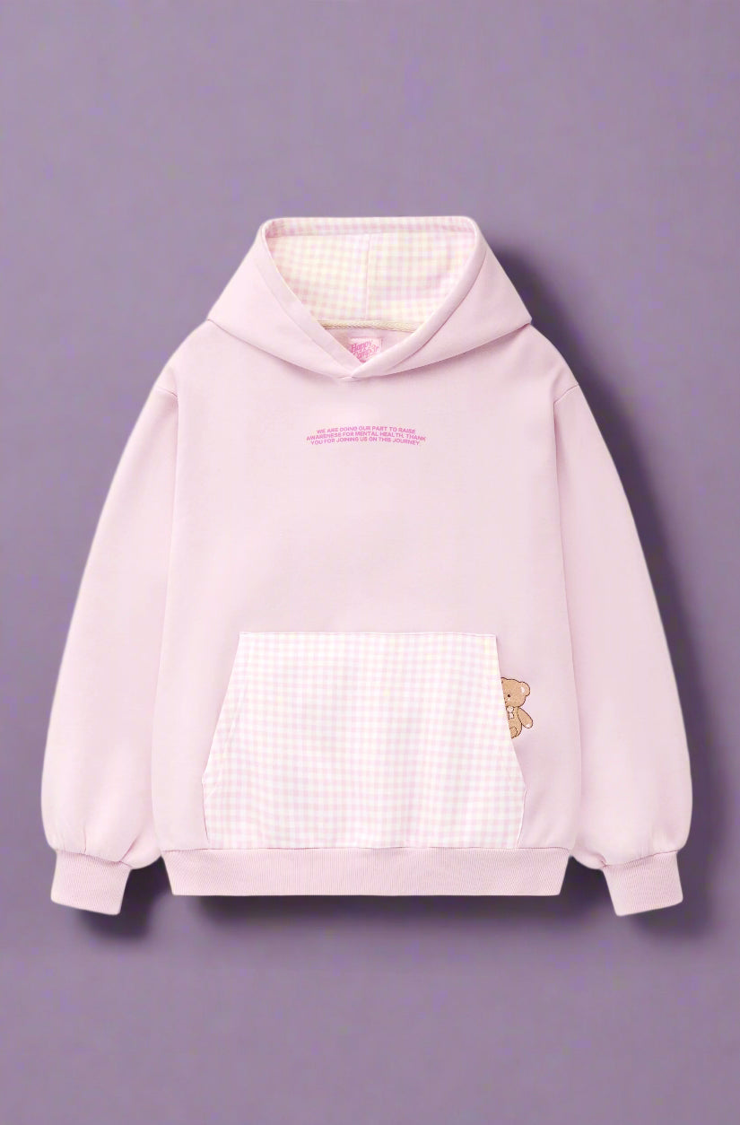 Pink hoodie with a checkered front panel and butterfly design on a white background