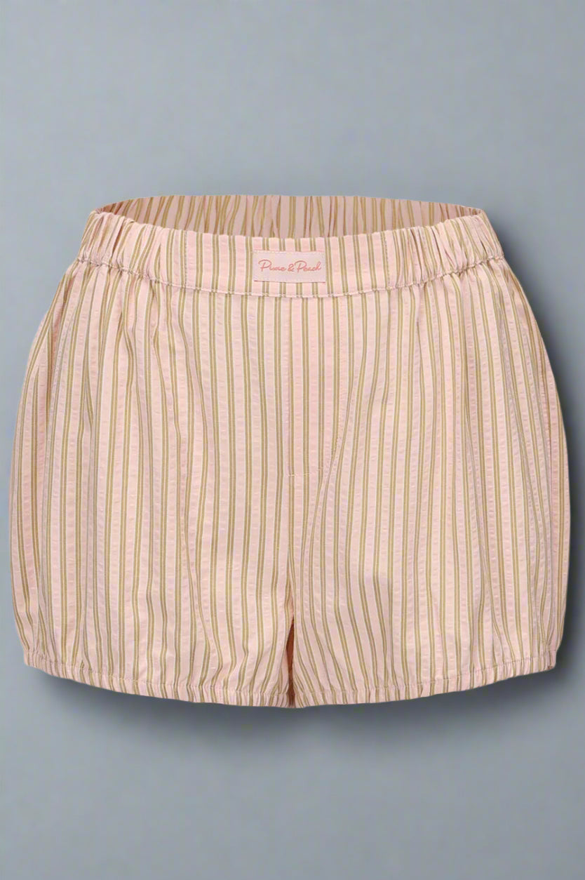 Beige striped shorts on a light gray background