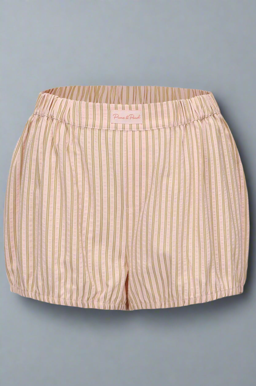 Beige striped shorts on a light gray background