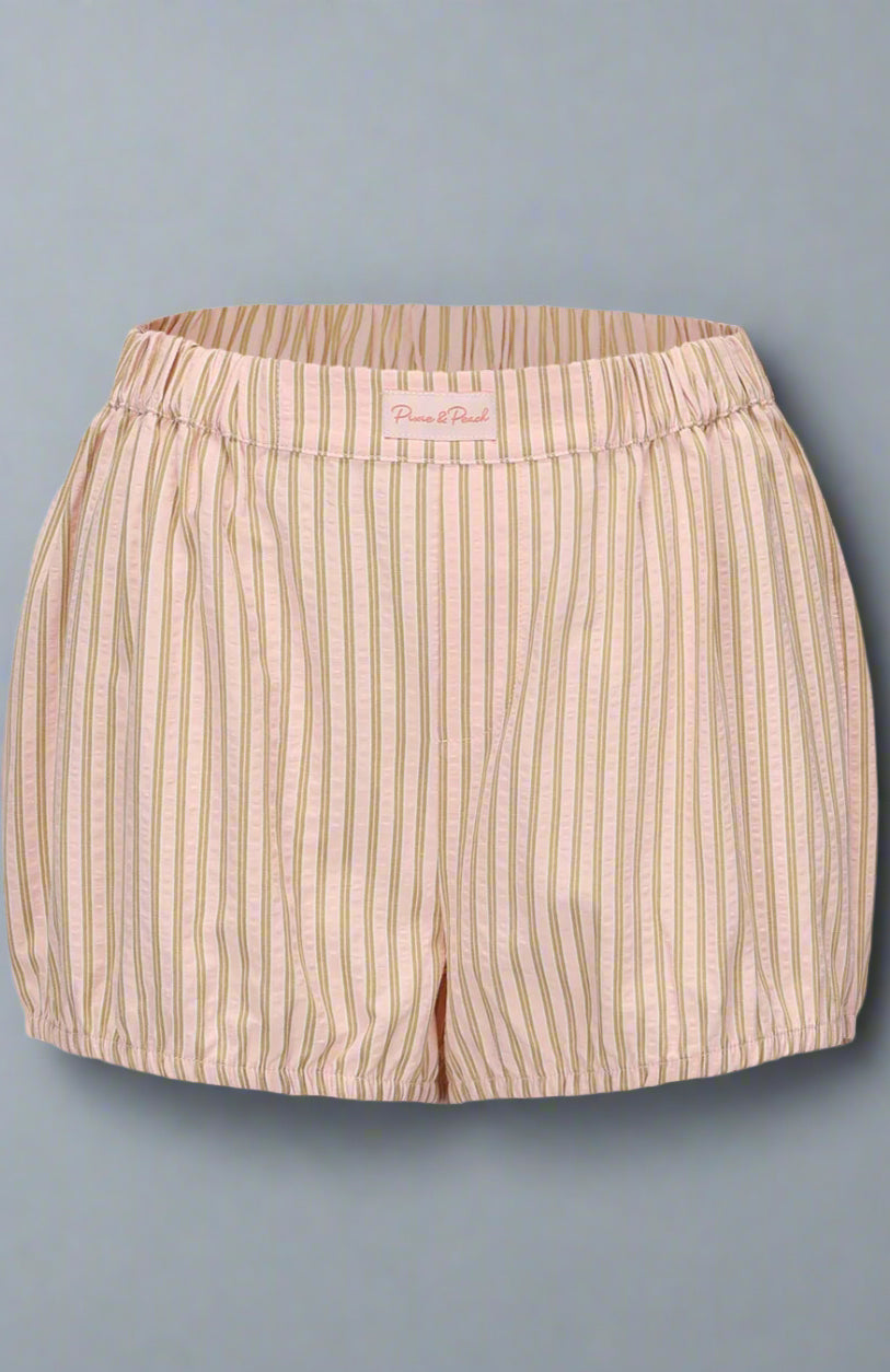 Beige striped shorts on a light gray background