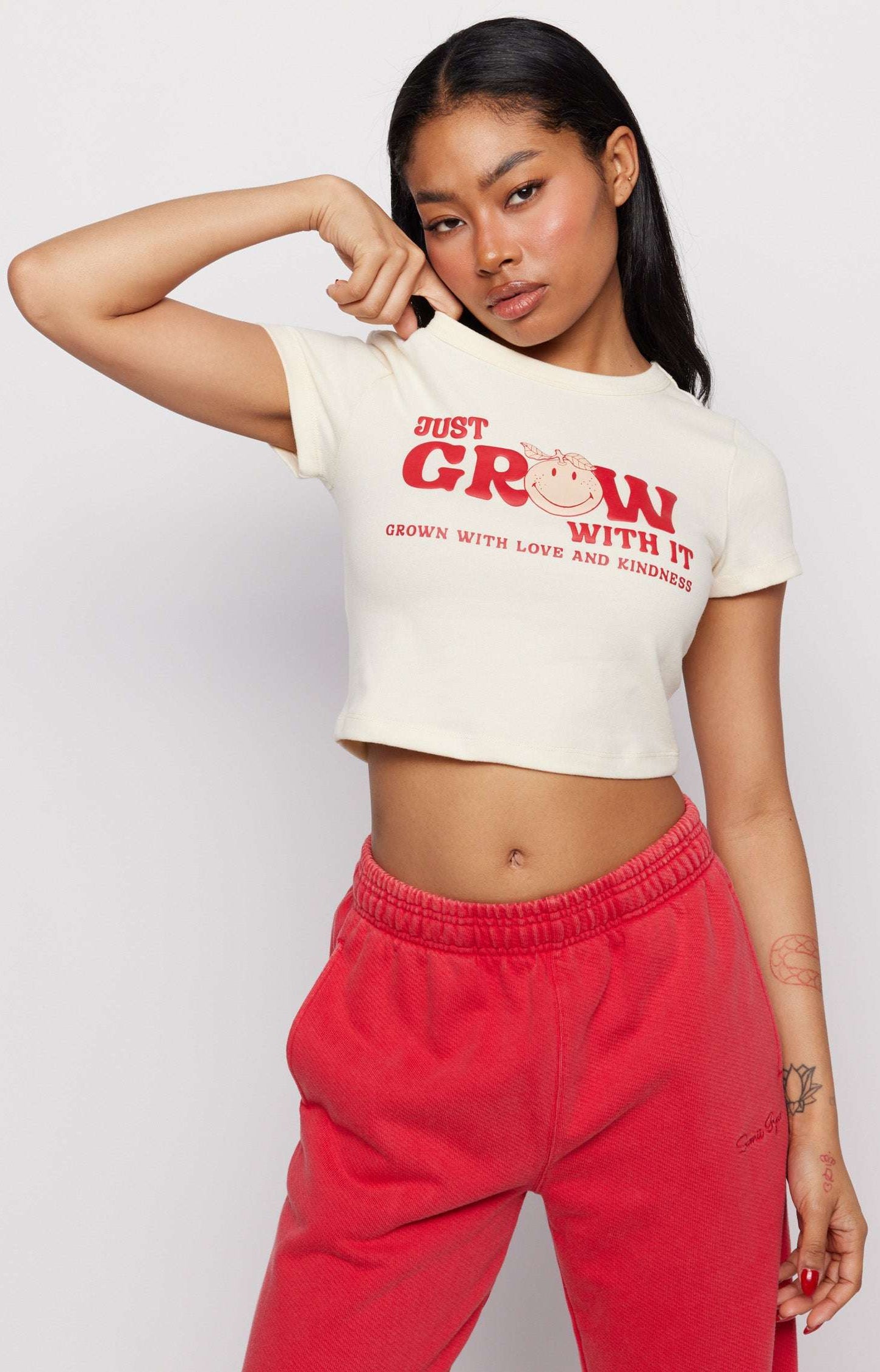 Samii Ryan x Smileyworld® Just Grow With It Baby Tee T-Shirt by Samii Ryan as seen on celebrities