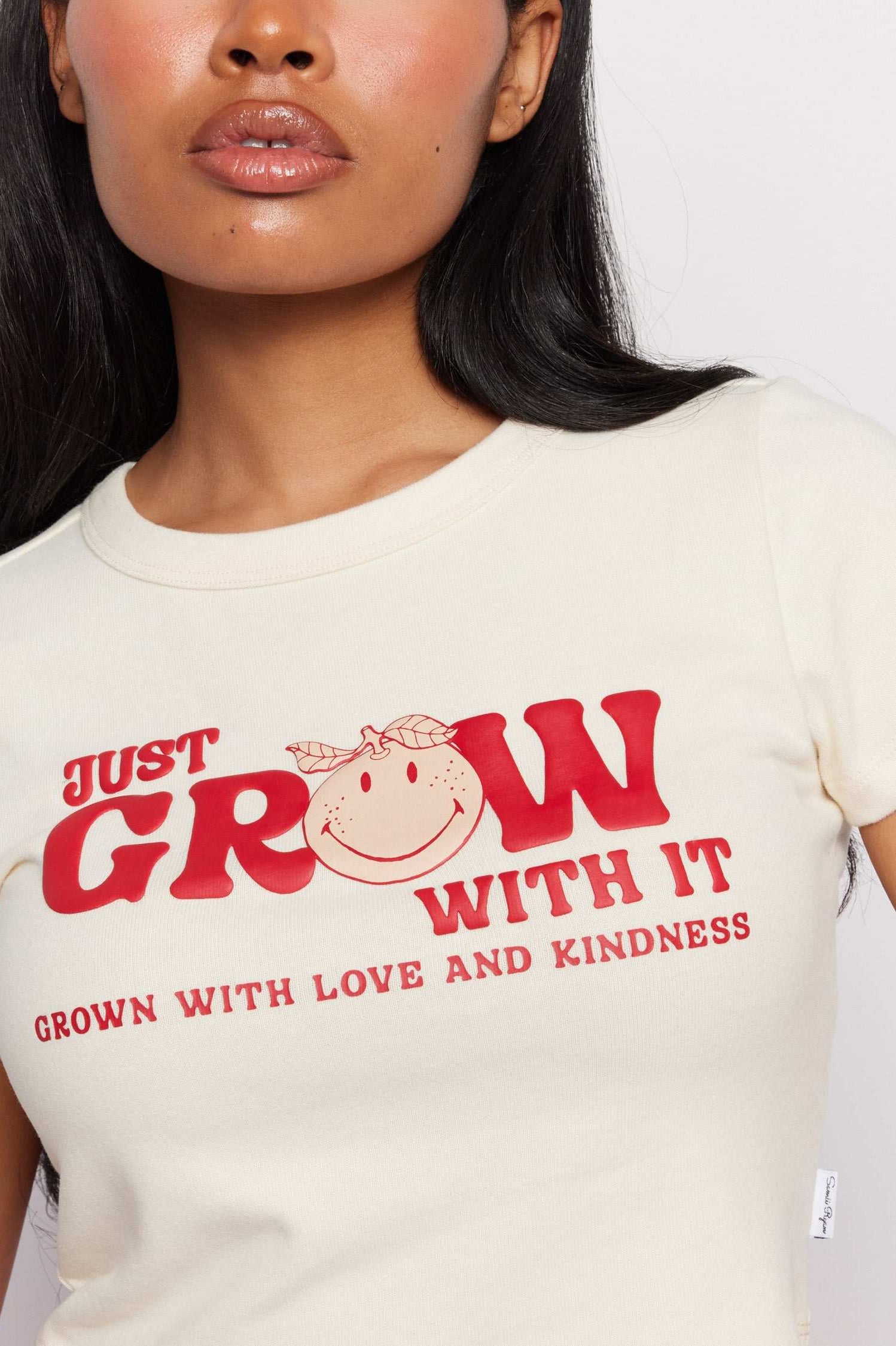 Samii Ryan x Smileyworld® Just Grow With It Baby Tee T-Shirt by Samii Ryan as seen on celebrities