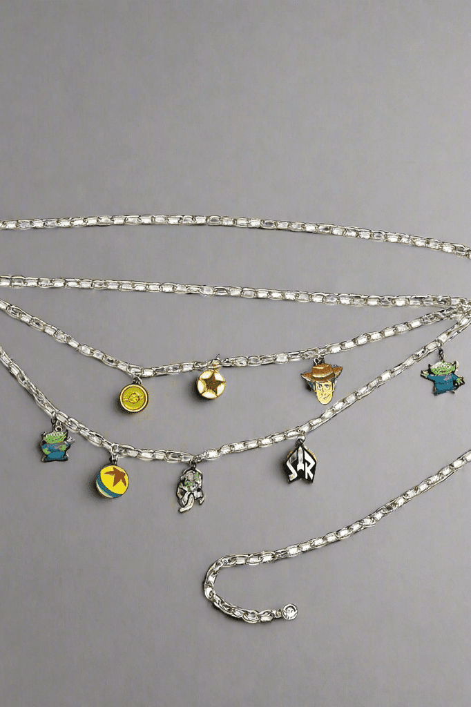 Shop Buckle Down Products Buckle Down Products Disney Toy Story Charm Chain Belt Belt for women – premium loungewear and festival fashion at Spoiled Brat