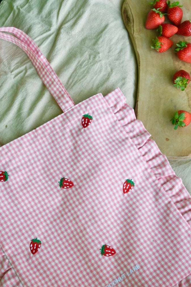 Shop Coconut Lane Coconut Lane Strawberry Picnic Tote Bag Tote Bag for women – premium loungewear and festival fashion at Spoiled Brat