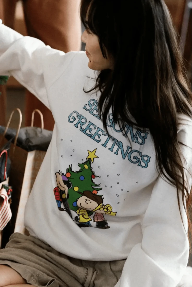 Shop Junk Food JUNKFOOD Peanuts Seasons Greetings Christmas Jumper Jumper for women – premium loungewear and festival fashion at Spoiled Brat