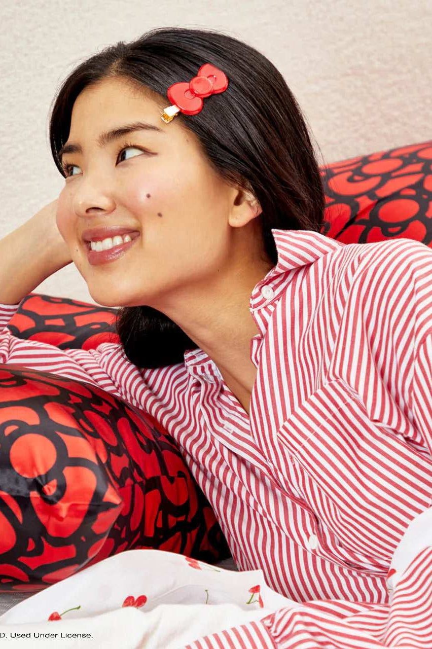 Shop Kitsch Hello Kitty x Kitsch Satin Pillowcase - Hello Kitty Bathes in a Sea of Bows Pillow for women – premium loungewear and festival fashion at Spoiled Brat