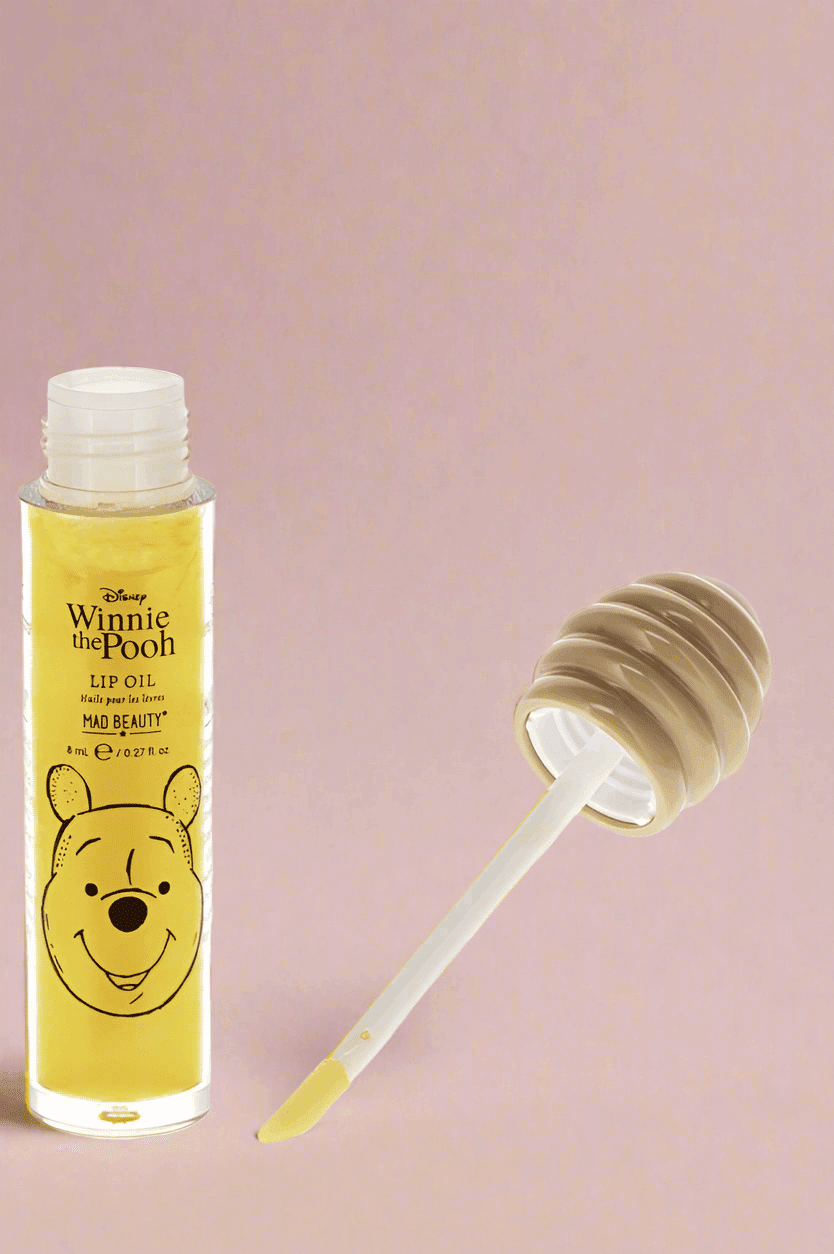 Shop Mad Beauty Mad Beauty Winnie The Pooh Lip Oil Lip Gloss for women – premium loungewear and festival fashion at Spoiled Brat