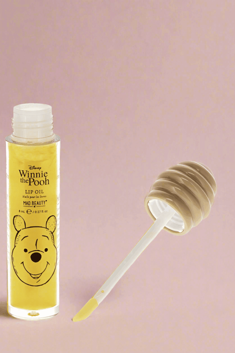 Shop Mad Beauty Mad Beauty Winnie The Pooh Lip Oil Lip Gloss for women – premium loungewear and festival fashion at Spoiled Brat