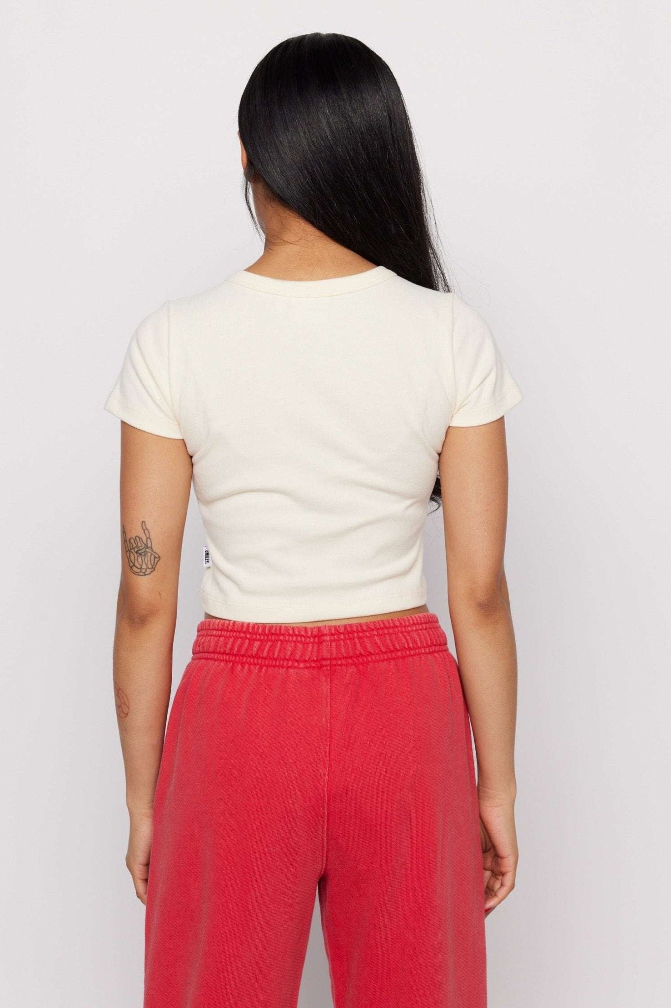 Shop Samii Ryan Samii Ryan x Smileyworld® Just Grow With It Baby Tee T-Shirt for women – premium loungewear and festival fashion at Spoiled Brat