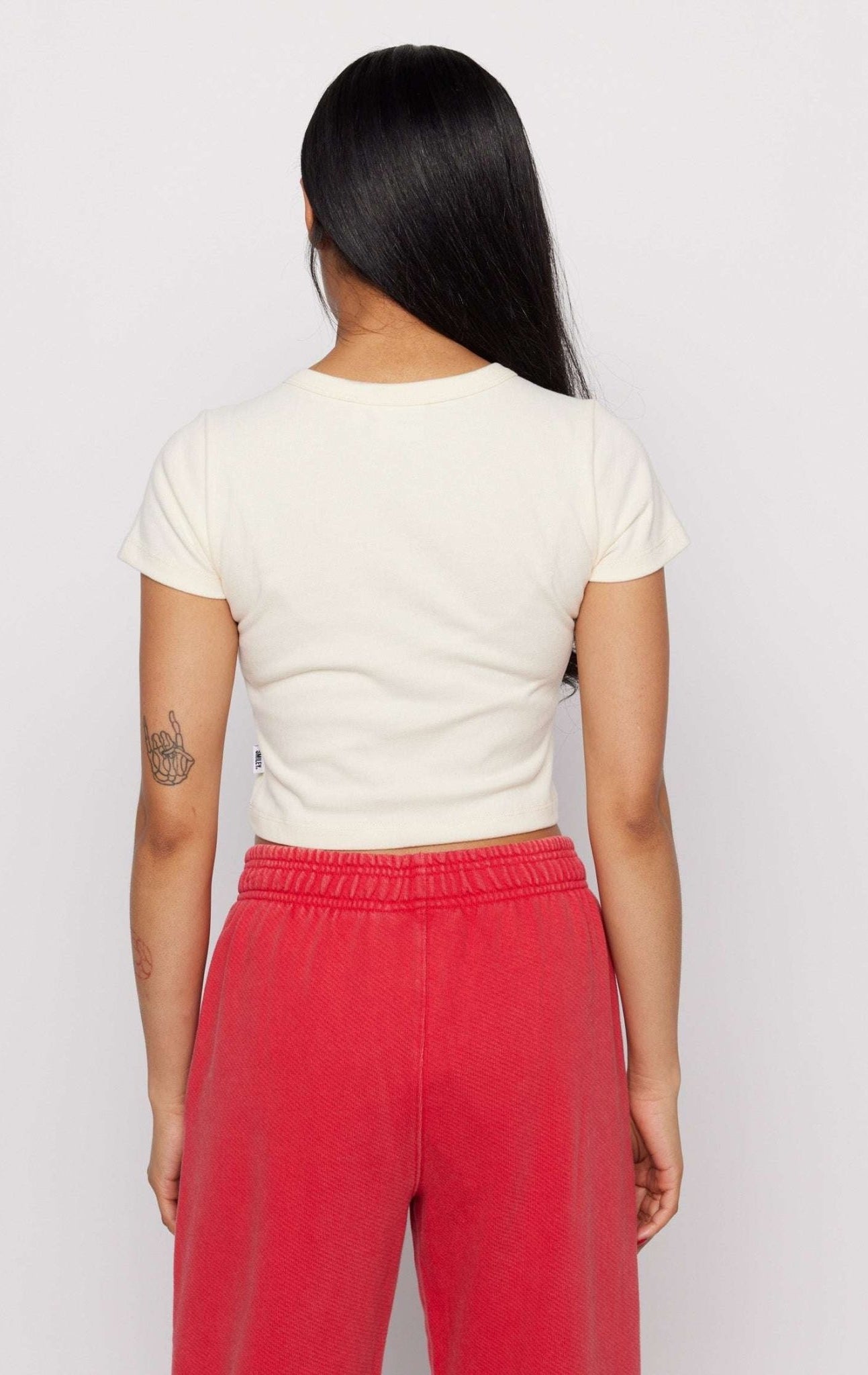 Shop Samii Ryan Samii Ryan x Smileyworld® Just Grow With It Baby Tee T-Shirt for women – premium loungewear and festival fashion at Spoiled Brat