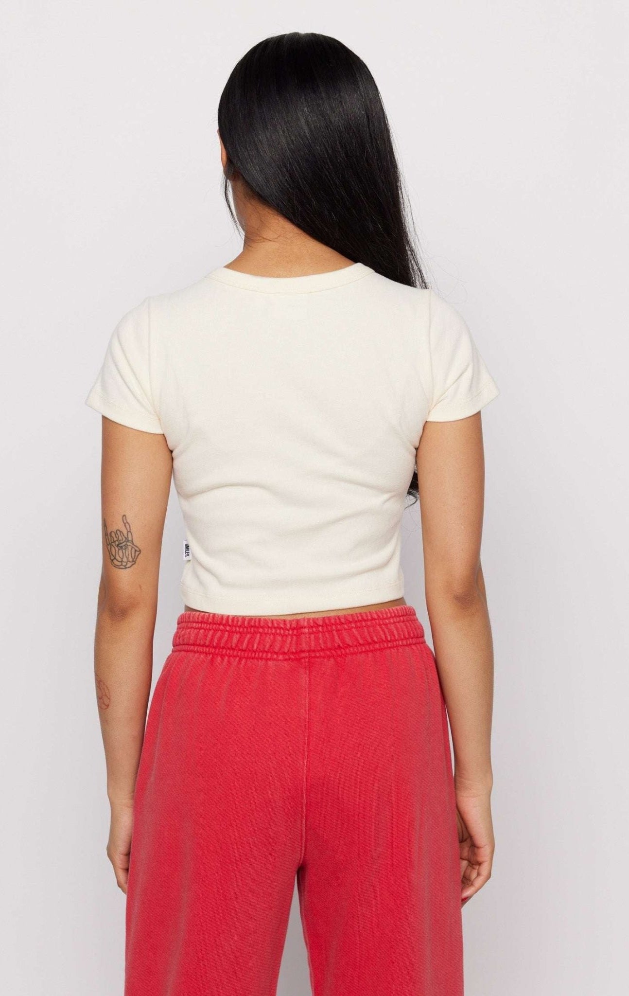 Shop Samii Ryan Samii Ryan x Smileyworld® Just Grow With It Baby Tee T-Shirt for women – premium loungewear and festival fashion at Spoiled Brat