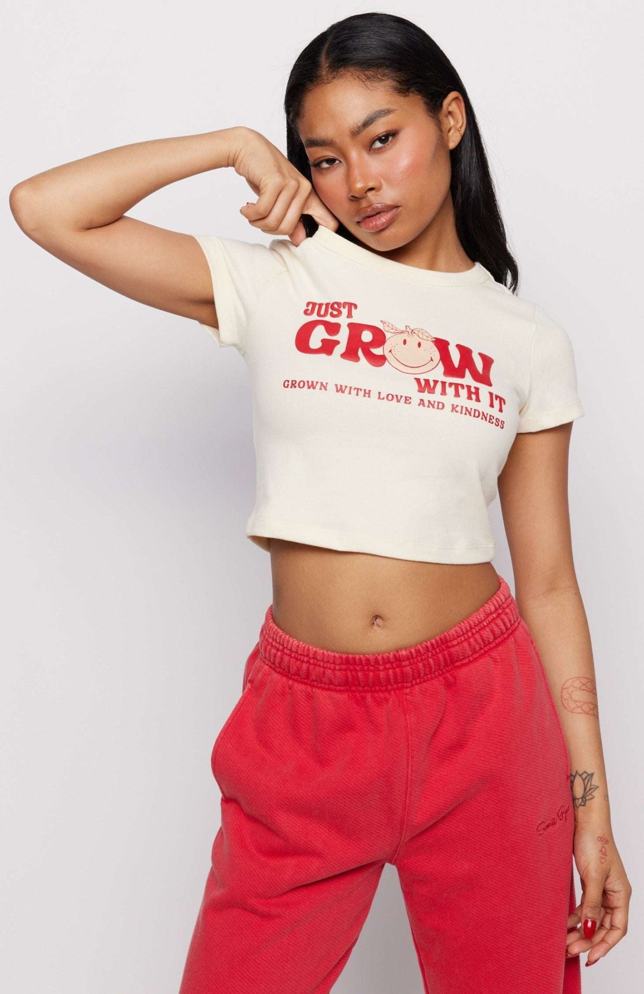 Shop Samii Ryan Samii Ryan x Smileyworld® Just Grow With It Baby Tee T-Shirt for women – premium loungewear and festival fashion at Spoiled Brat