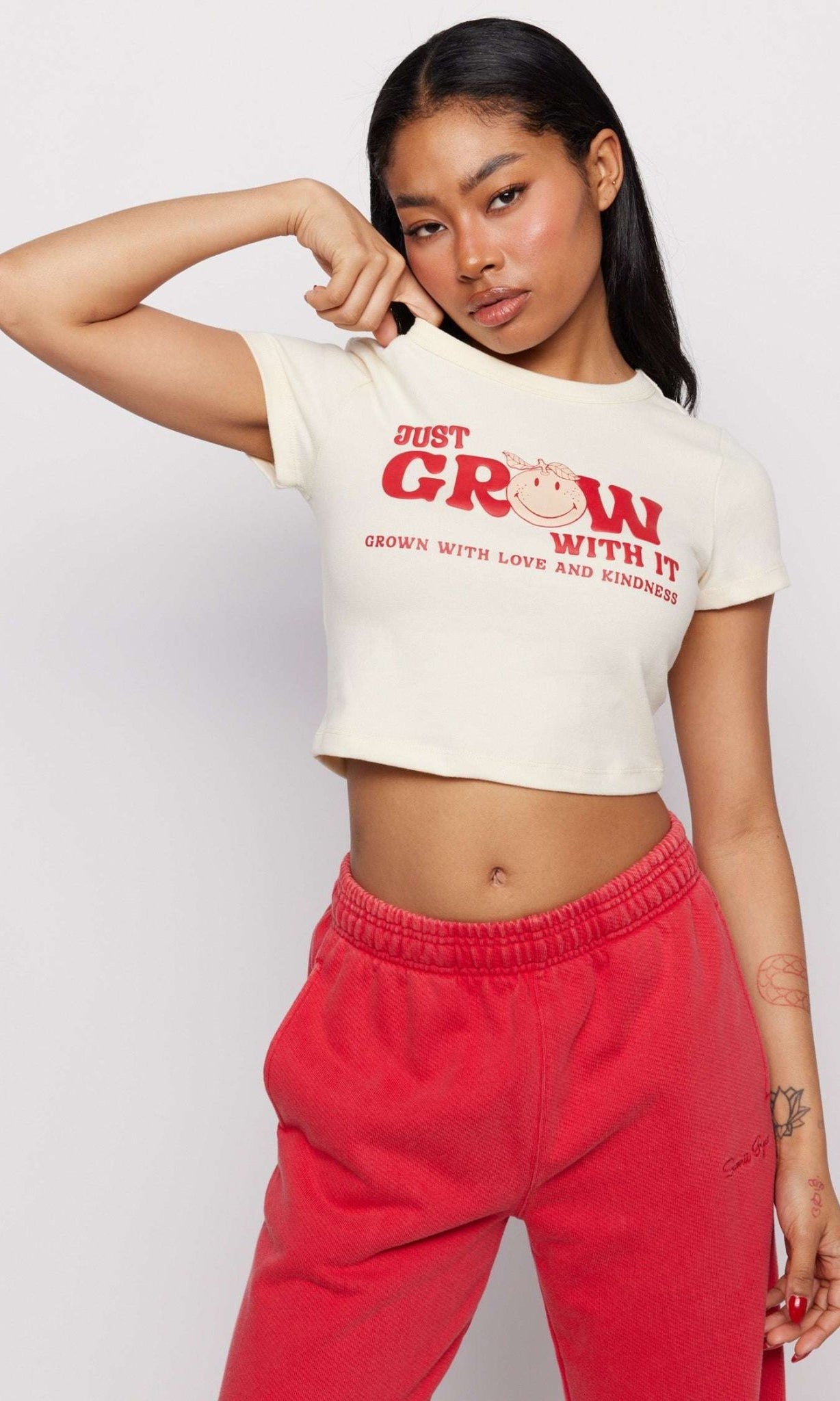Shop Samii Ryan Samii Ryan x Smileyworld® Just Grow With It Baby Tee T-Shirt for women – premium loungewear and festival fashion at Spoiled Brat