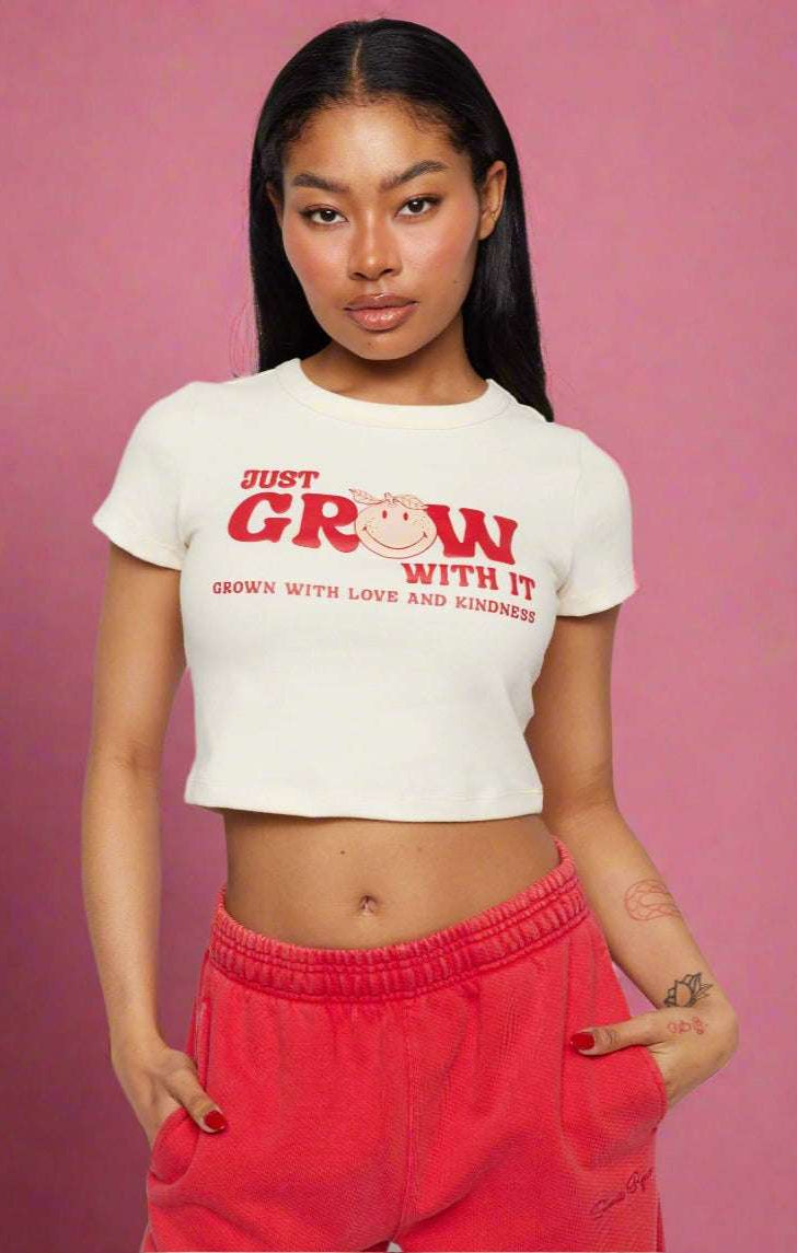 Shop Samii Ryan Samii Ryan x Smileyworld® Just Grow With It Baby Tee T-Shirt for women – premium loungewear and festival fashion at Spoiled Brat