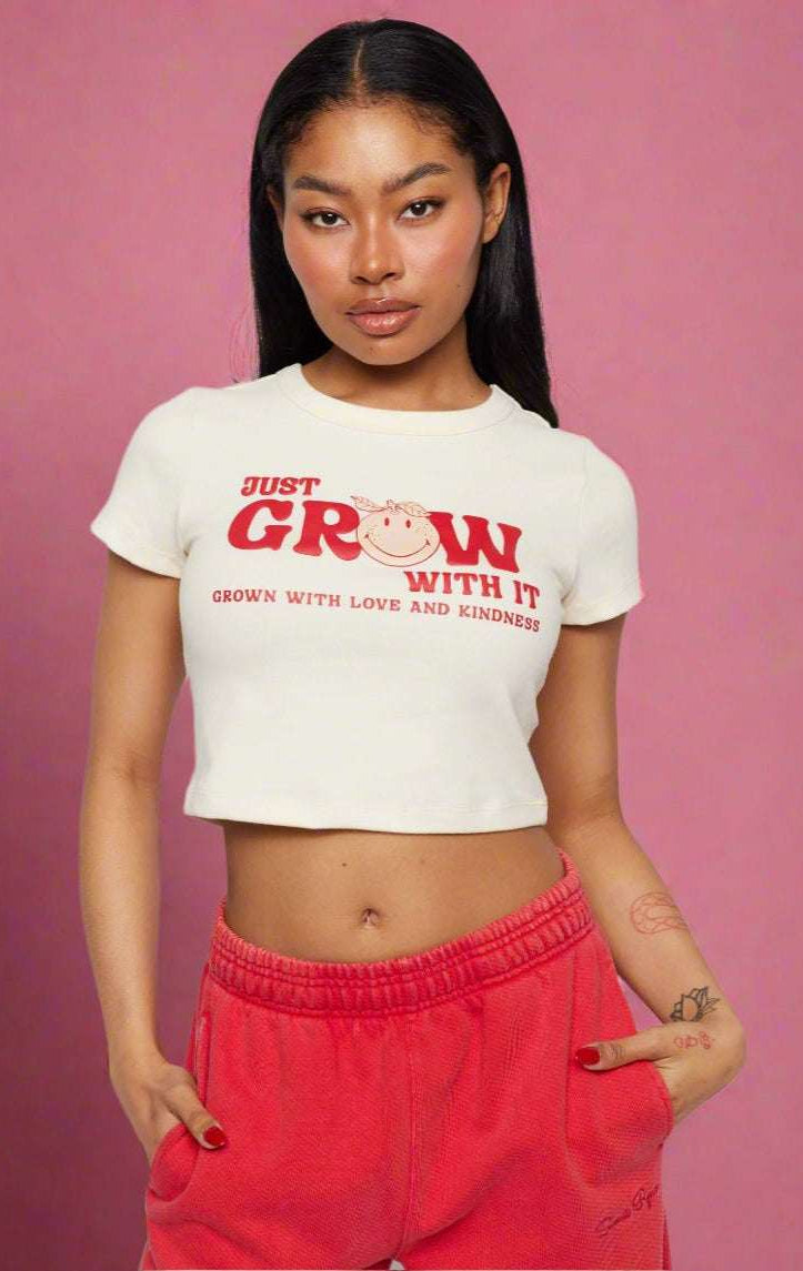 Shop Samii Ryan Samii Ryan x Smileyworld® Just Grow With It Baby Tee T-Shirt for women – premium loungewear and festival fashion at Spoiled Brat