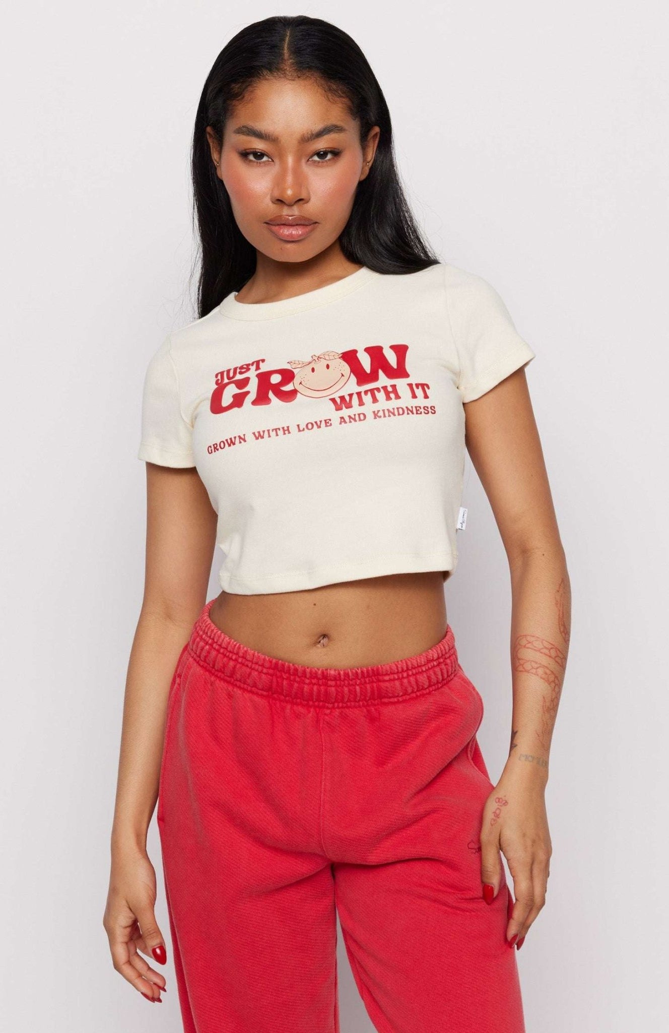 Shop Samii Ryan Samii Ryan x Smileyworld® Just Grow With It Baby Tee T-Shirt for women – premium loungewear and festival fashion at Spoiled Brat