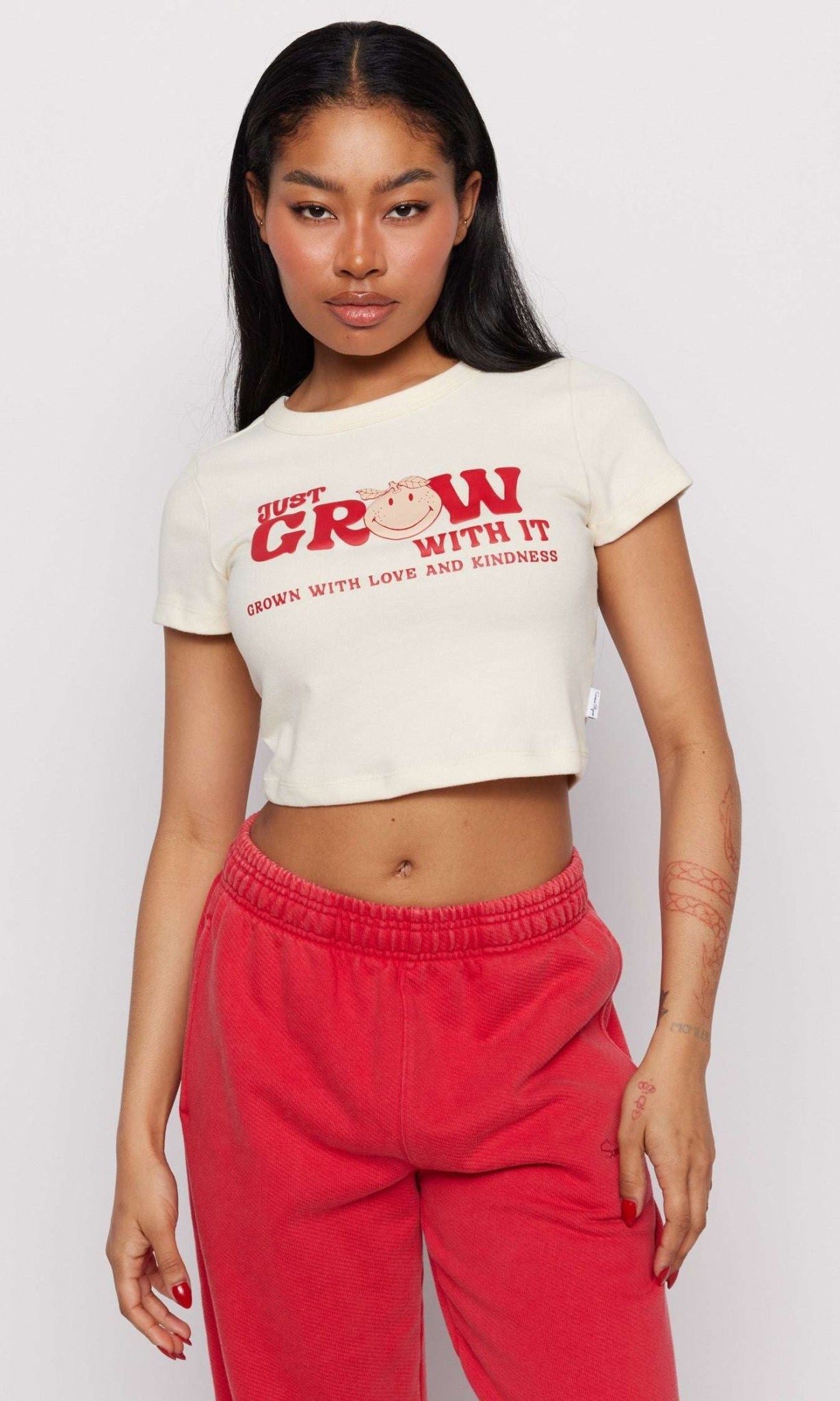 Shop Samii Ryan Samii Ryan x Smileyworld® Just Grow With It Baby Tee T-Shirt for women – premium loungewear and festival fashion at Spoiled Brat