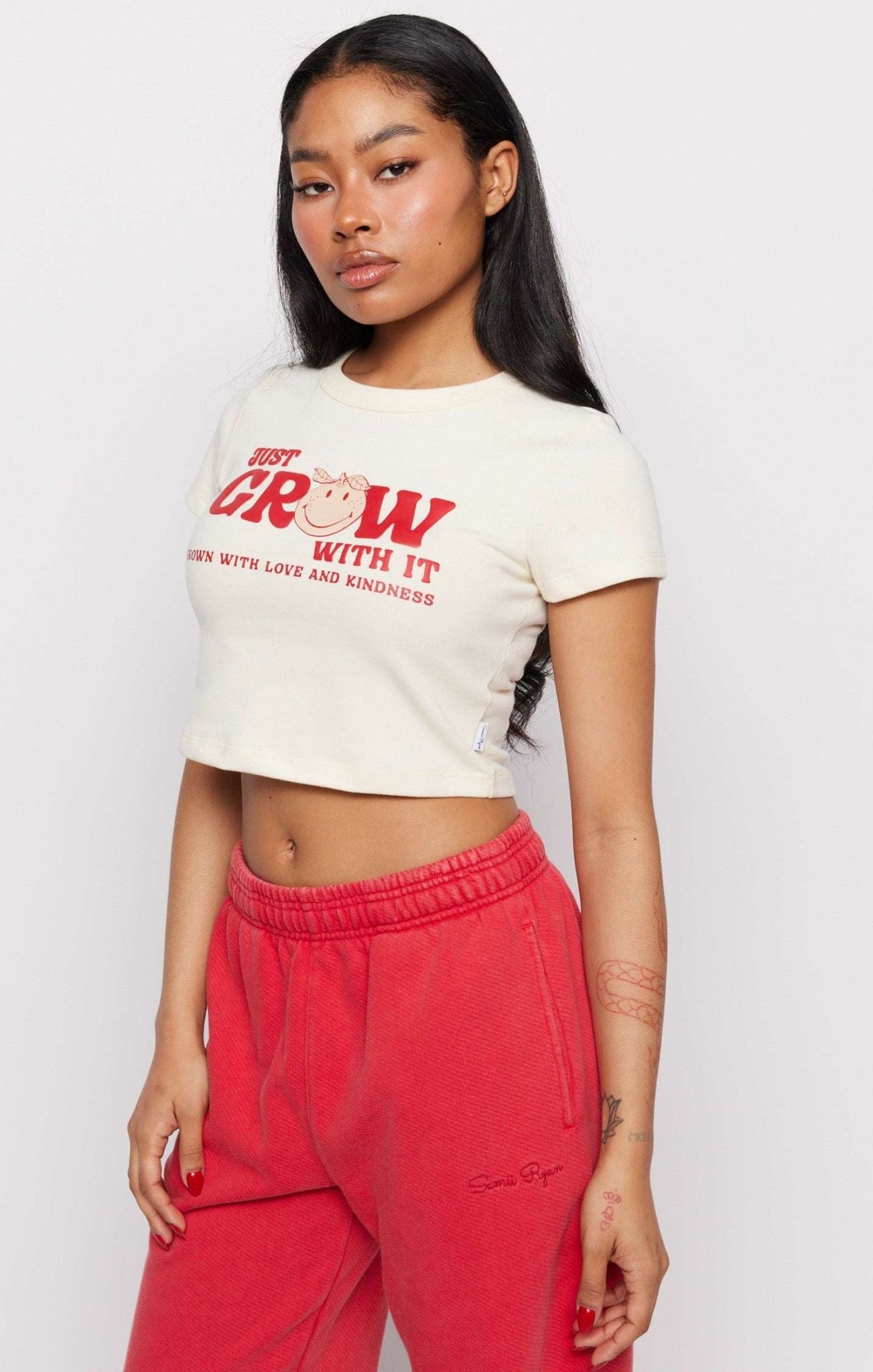 Shop Samii Ryan Samii Ryan x Smileyworld® Just Grow With It Baby Tee T-Shirt for women – premium loungewear and festival fashion at Spoiled Brat