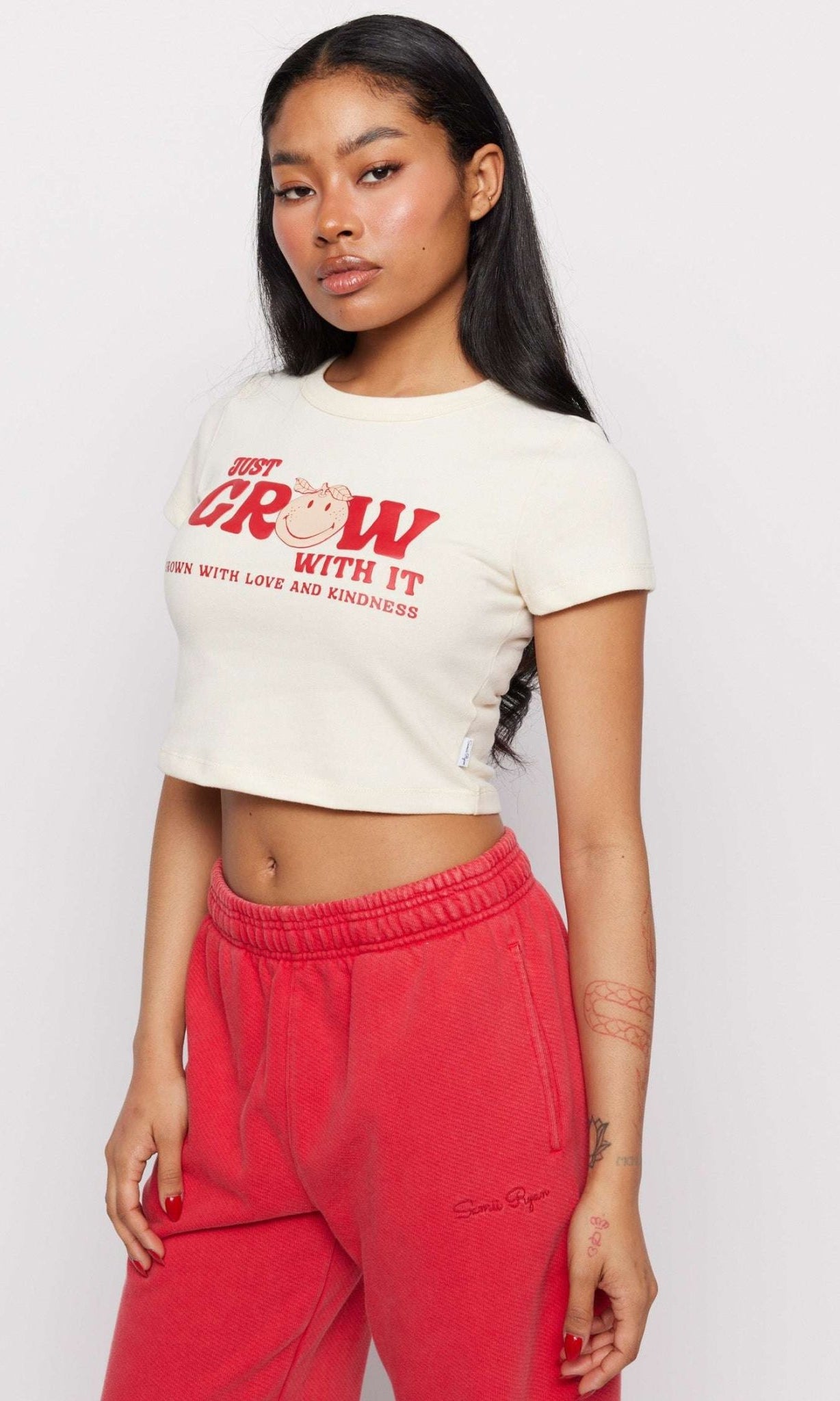 Shop Samii Ryan Samii Ryan x Smileyworld® Just Grow With It Baby Tee T-Shirt for women – premium loungewear and festival fashion at Spoiled Brat