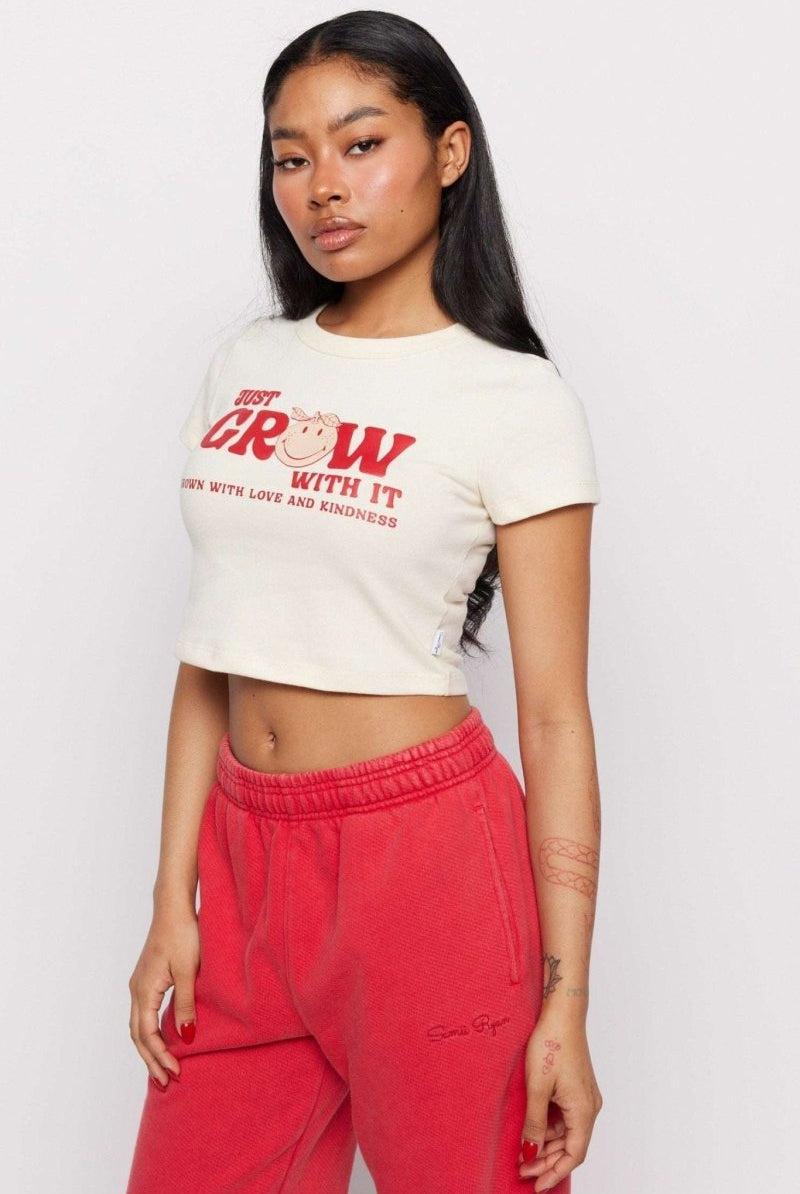 Shop Samii Ryan Samii Ryan x Smileyworld® Just Grow With It Baby Tee T-Shirt for women – premium loungewear and festival fashion at Spoiled Brat