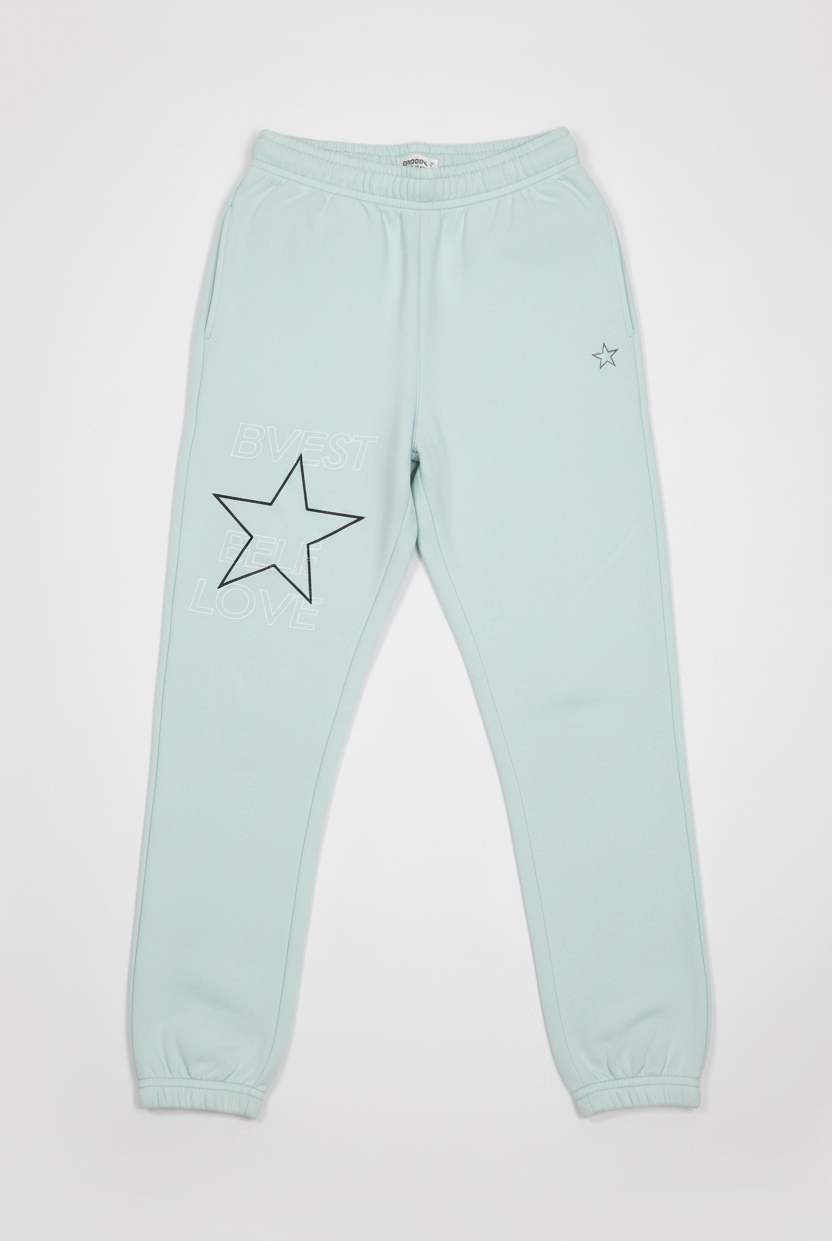 Light blue sweatpants with a star design on a white background