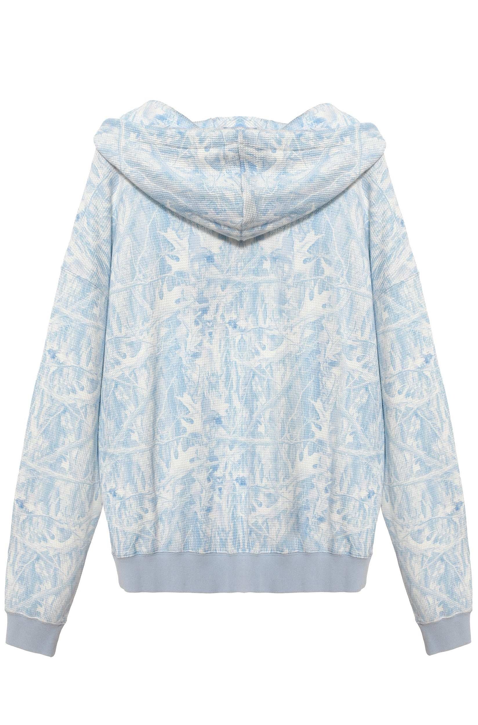 Light blue and white floral patterned hoodie on a white background