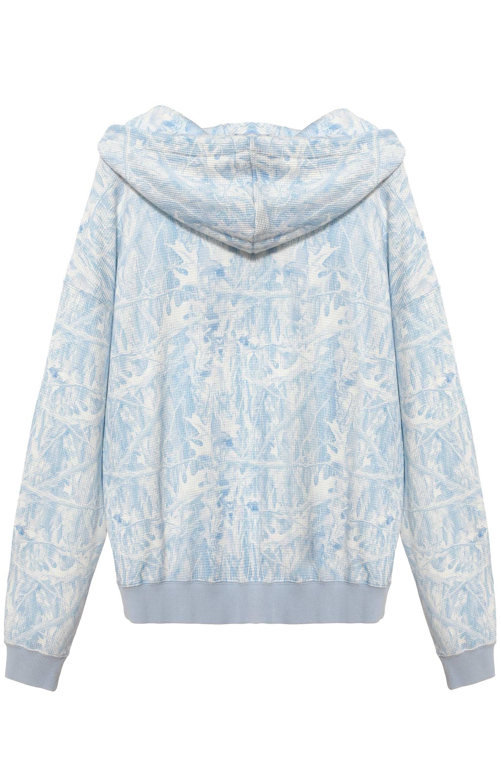 Light blue and white floral patterned hoodie on a white background