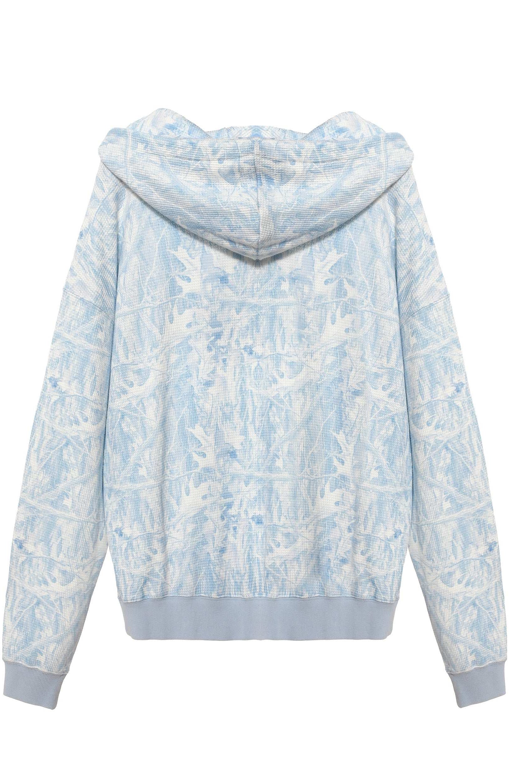 Light blue and white floral patterned hoodie on a white background