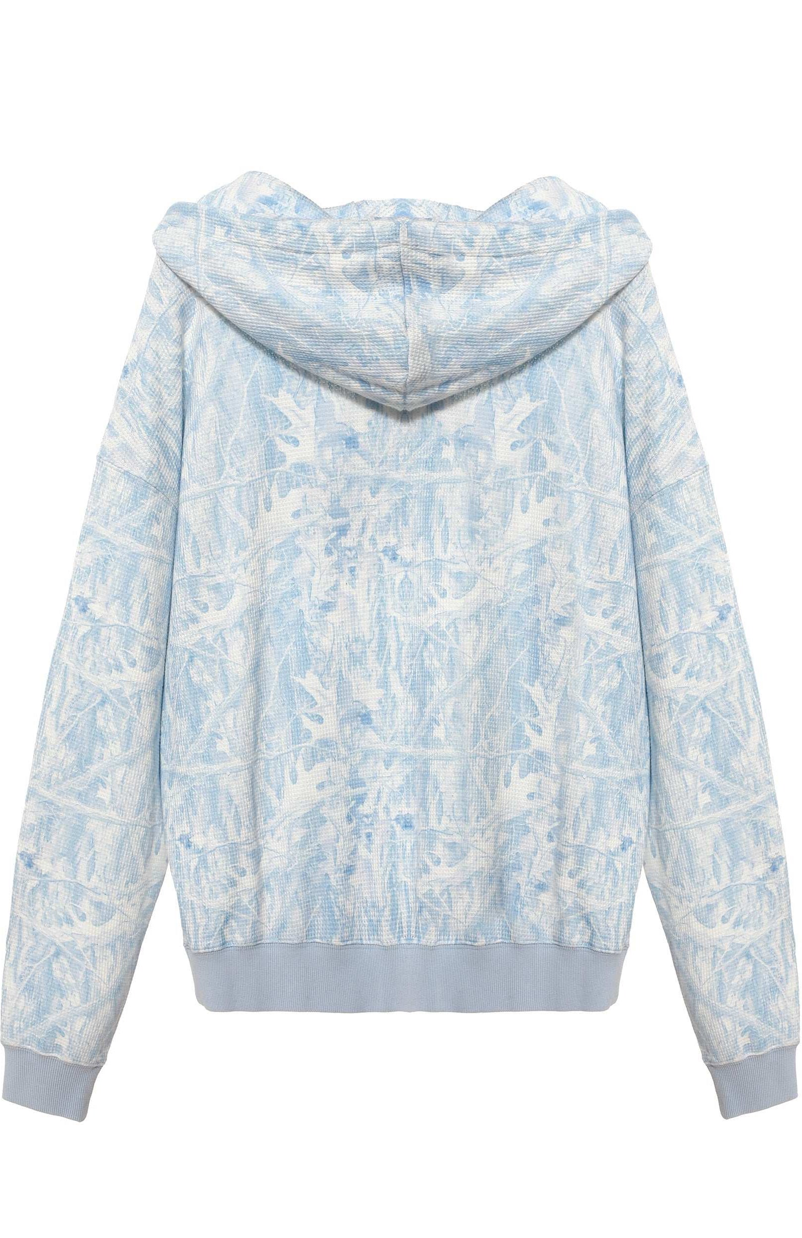 Light blue and white floral patterned hoodie on a white background