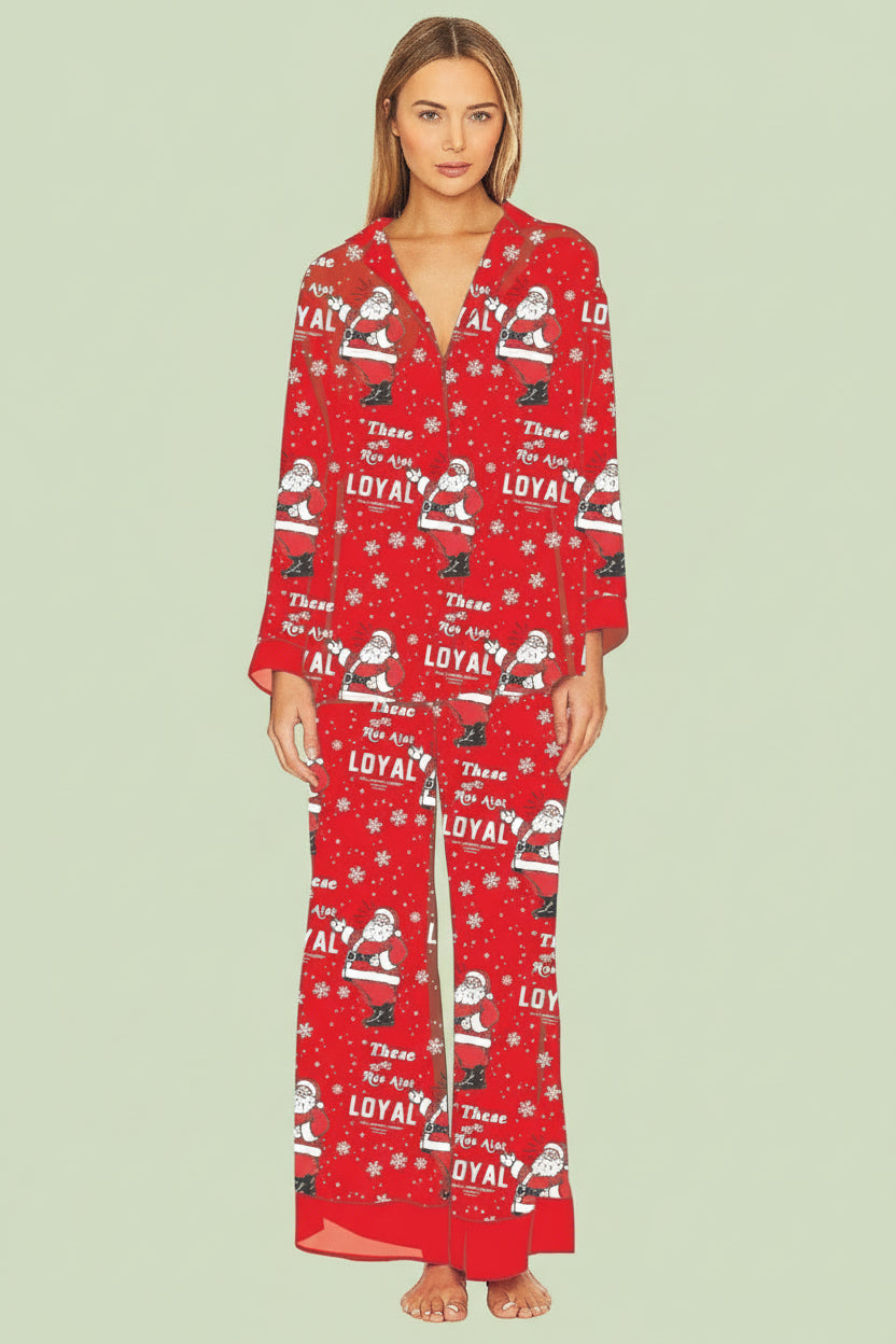 Woman wearing a red pajama set with festive pattern on a white background