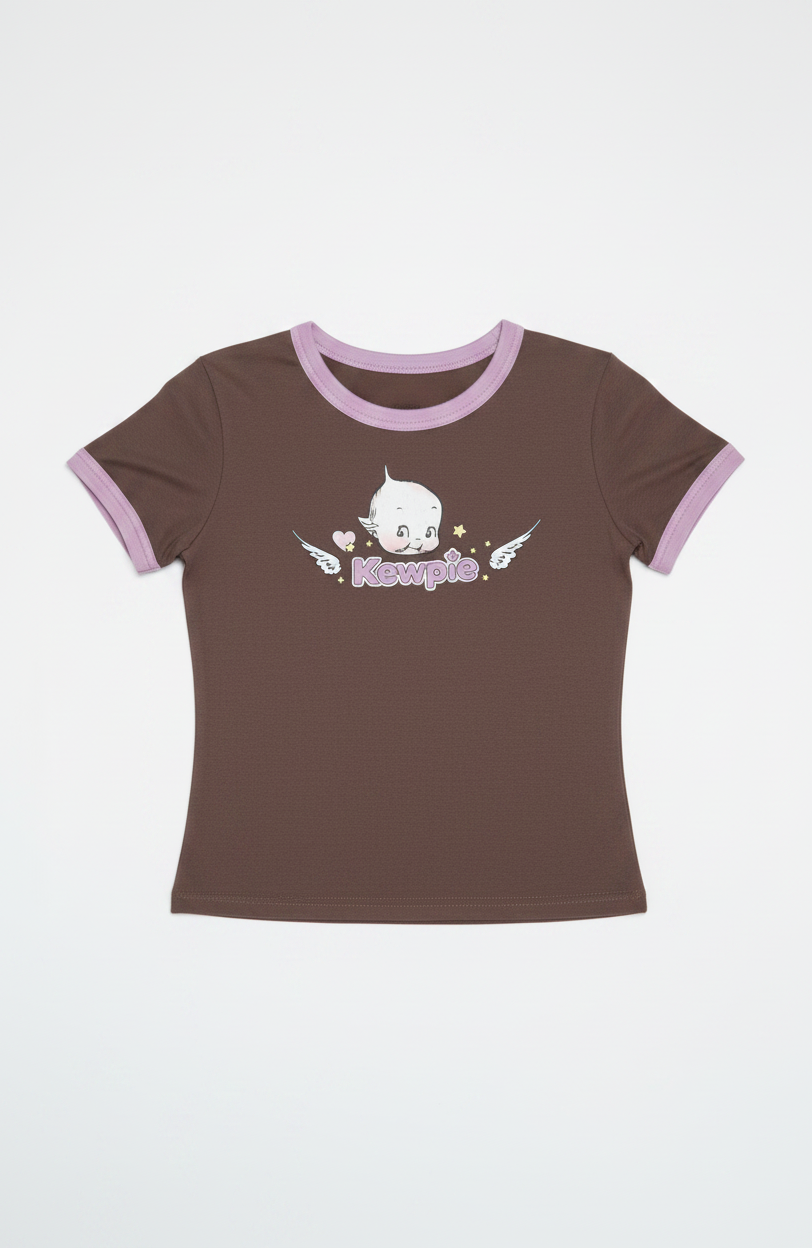 Woman wearing a brown t-shirt with a graphic design on a plain background