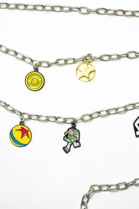 Shop Buckle Down Products Buckle Down Products Disney Toy Story Charm Chain Belt Belt for women – premium loungewear and festival fashion at Spoiled Brat